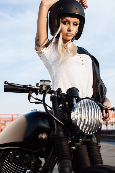 fashion female biker girl with vintage custom motorcycle - Zdjęcie, obraz