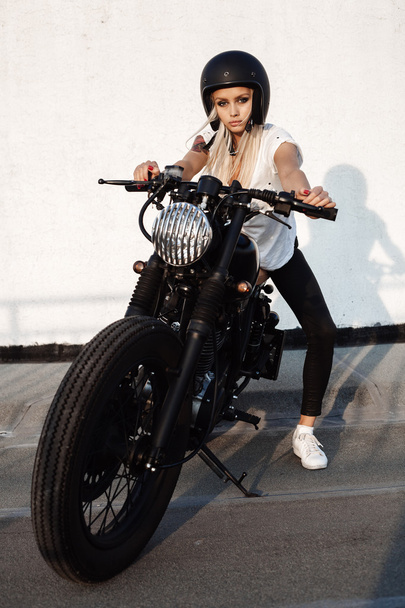 fashion female biker girl with vintage custom motorcycle - Fotografie, Obrázek