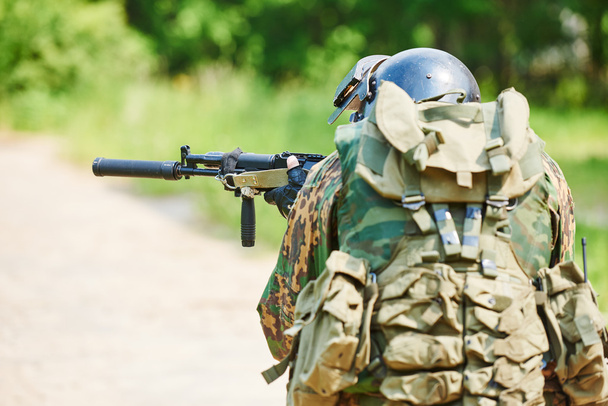 Military soldier with assault rifle patrolling - Photo, image