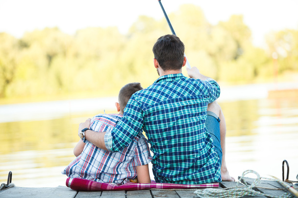 Man and boy fishing on the lake - Zdjęcie, obraz