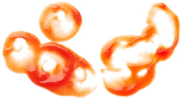 Manchas de ketchup aisladas sobre fondo blanco
 - Foto, imagen