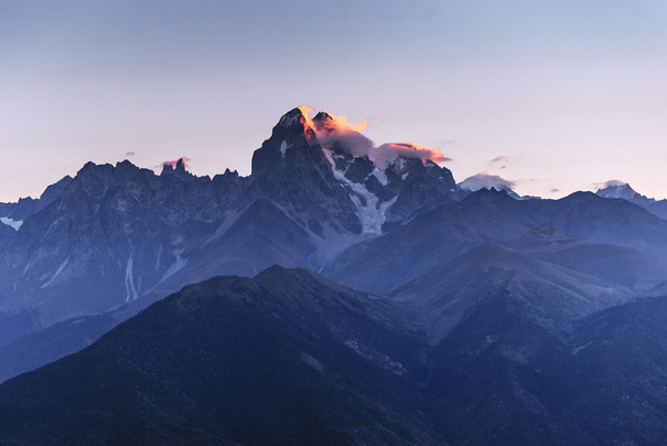 Autumn landscape and snow-capped mountain peaks. View of the mou - Photo, Image