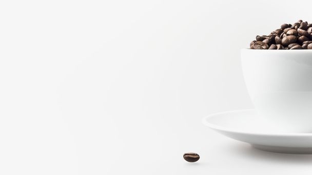 Coffee beans in white cup - Zdjęcie, obraz
