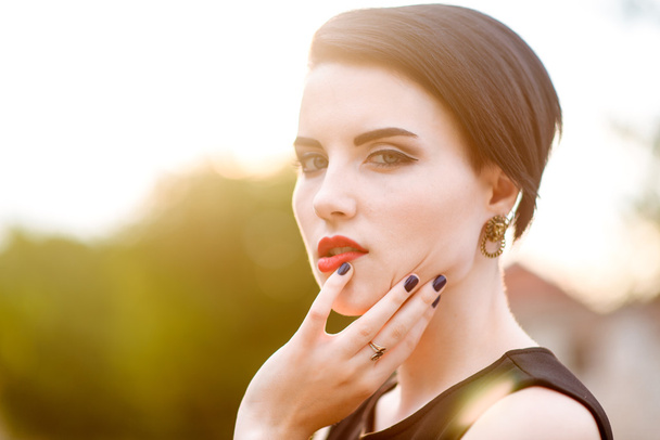 Girl with red lips at sunset - Photo, Image