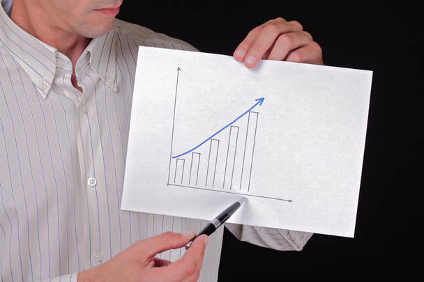 Close up to businessman hands showing  holding a rising arrow, representing business growth. Manager showing presentation of progressive arrow chart. Business vision, success, team work,  leadership c - Photo, Image