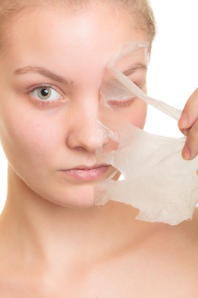 girl removing facial peel off mask - Photo, Image