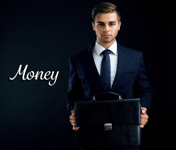 Elegant man in suit with briefcase - Foto, afbeelding