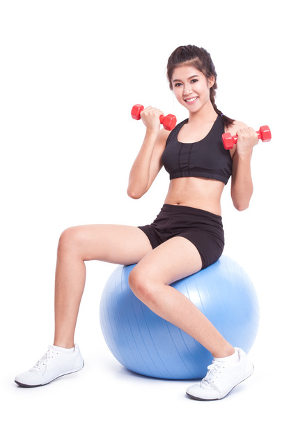 woman training with exercise ball and weights - Foto, Imagem