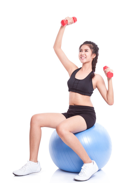 woman training with exercise ball and weights - Фото, изображение
