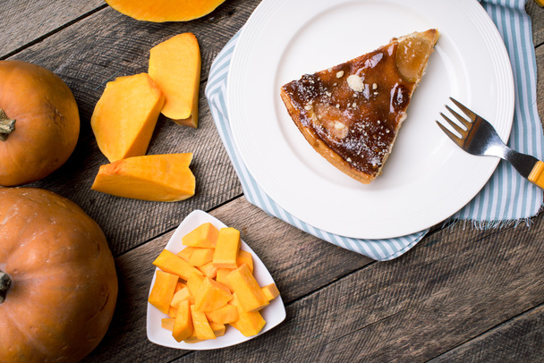 Pumpkin slices and piece of pie - Фото, изображение