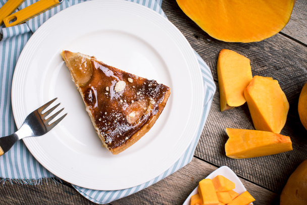 Piece of pie and pumpkin slices - Фото, зображення