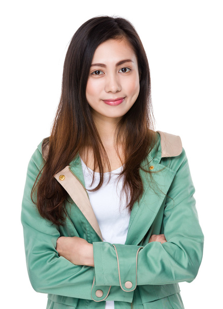 Asian young woman in green coat - Φωτογραφία, εικόνα