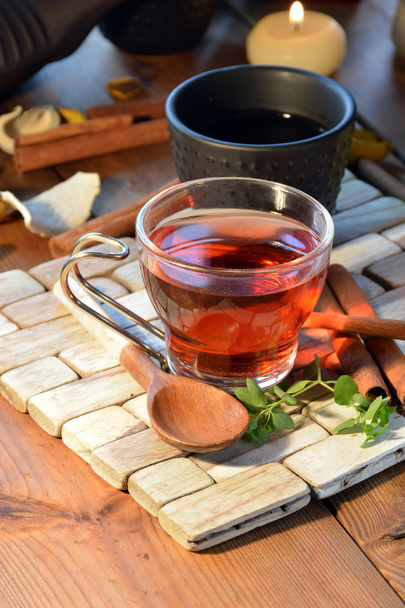 cups of black tea accompanied by incense - Φωτογραφία, εικόνα