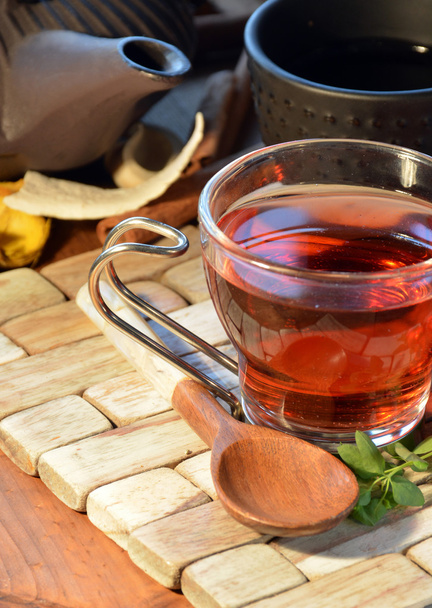 cups of red tea accompanied by incense - Фото, зображення