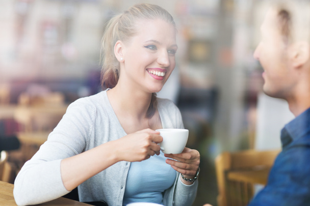 Couple drinking coffee in cafe - Photo, image