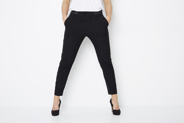 Woman in black heels and trousers - Photo, Image