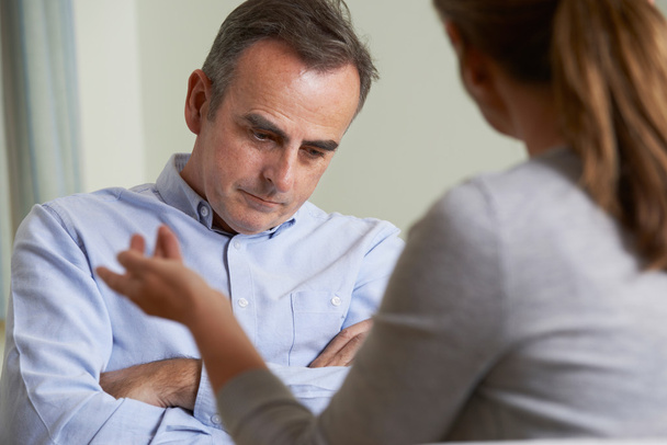 Depressed Mature Man Talking To Counsellor - Foto, afbeelding