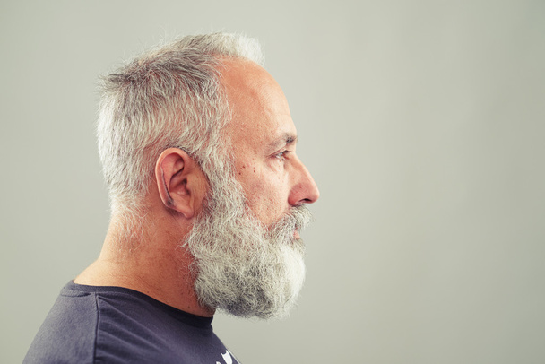 senior bearded man over light grey background - Photo, Image