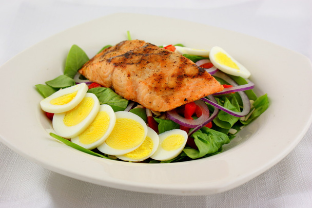 Salmon spinach salad with fresh baby spinach - Photo, Image