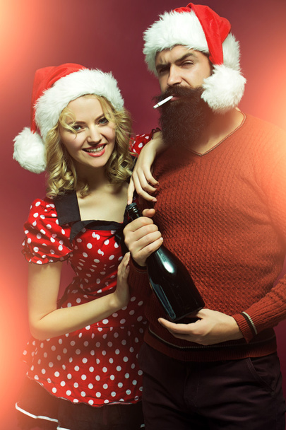 Christmas couple with bottle and cigarette - Fotografie, Obrázek