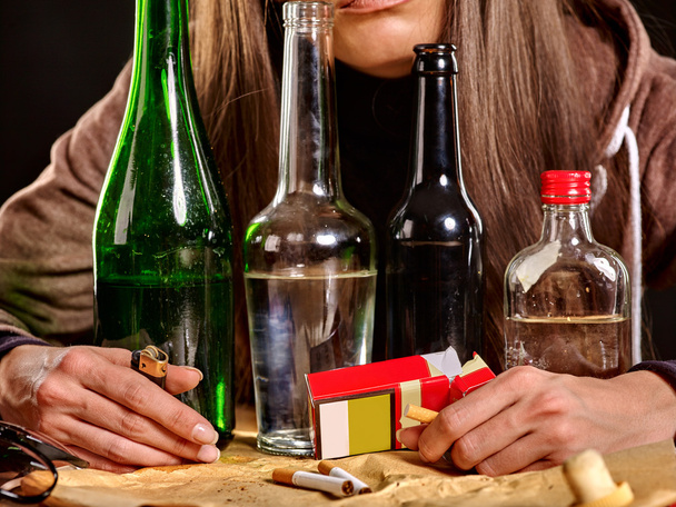 Girl  drinking alcohol and smokes cigarettes. - 写真・画像