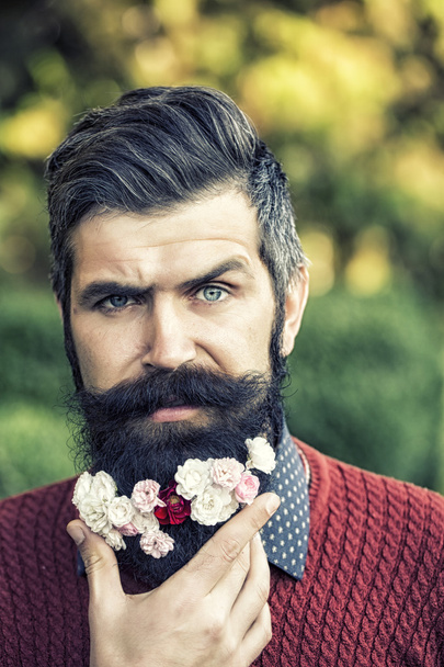 Man with flowers on beard - Foto, imagen