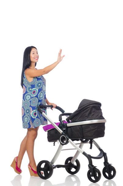 Счастливая мама с ребенком в коляске - Фото, изображение