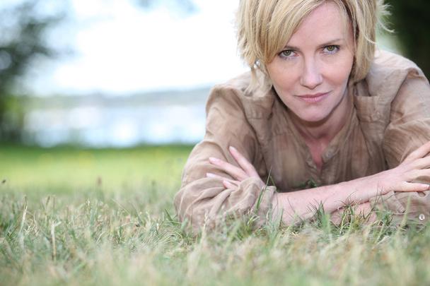 Woman lying on the grass - Fotografie, Obrázek