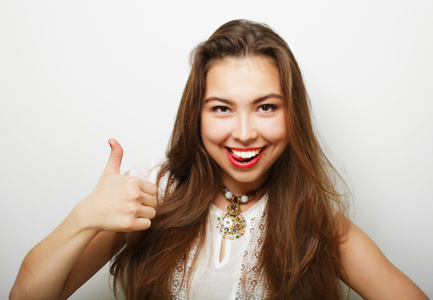 Successful girl gives thumb up with two hands - Foto, immagini