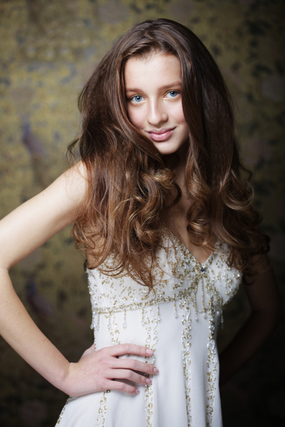 young woman with long curly hair - Foto, Bild