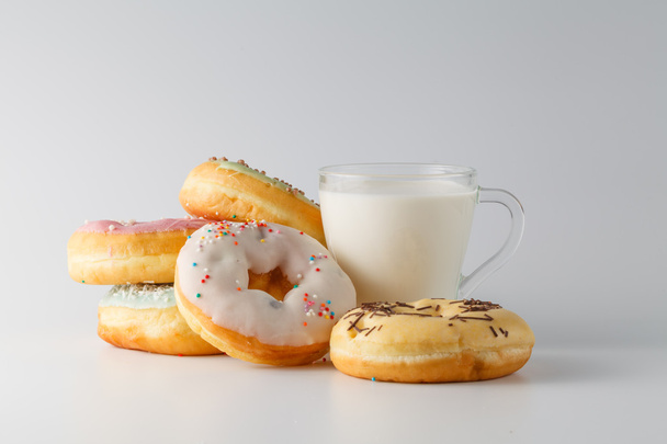 Colored donuts on white plain background - Fotografie, Obrázek