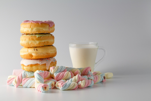 Colored donuts on white plain background - Foto, Bild