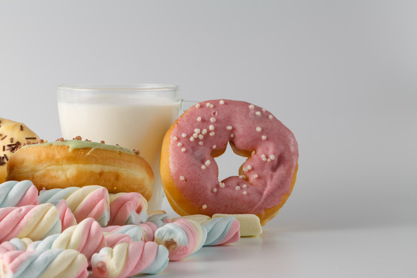 Colored donuts on white plain background - Foto, Bild