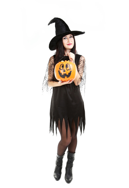 Young brunette witch with pumpkin basket - Fotoğraf, Görsel
