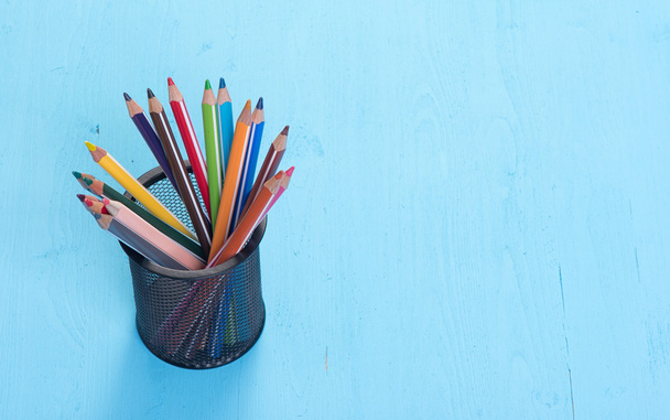 colorful pencils on blue background - Fotoğraf, Görsel