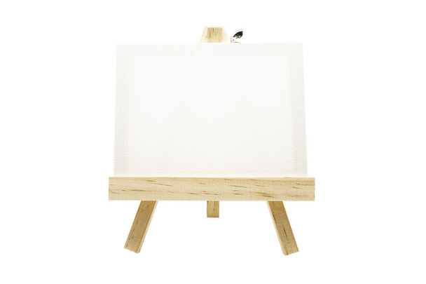 Mini cavalletto in legno con telaio in tela bianca isolato
 - Foto, immagini