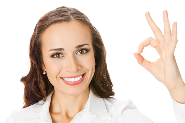 Business woman with okay gesture, on white - Foto, Bild