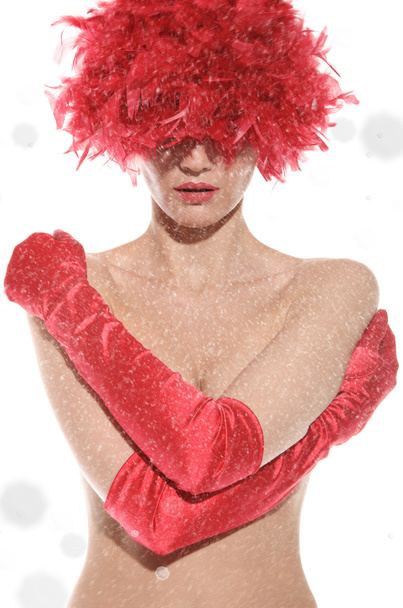 sexy woman in red wig, gloves covers breast, with snow - Foto, Imagen