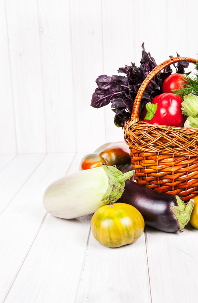 fresh vegetables in the basket on white wooden background - Foto, Imagem