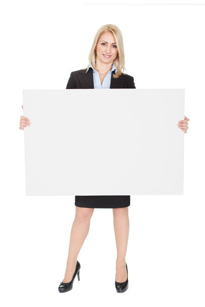 Cheerful businesswomen presenting empty board - 写真・画像