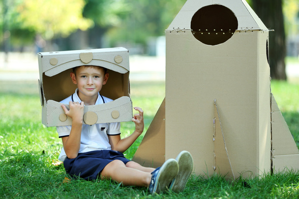 Funny boy in carton helmet  - Fotó, kép