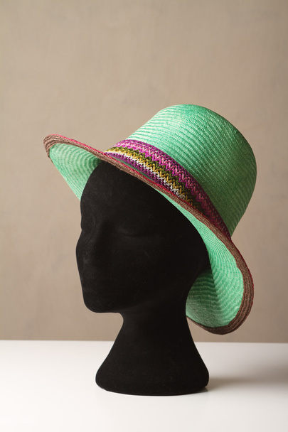 Ladies green fashion hat on display - 写真・画像