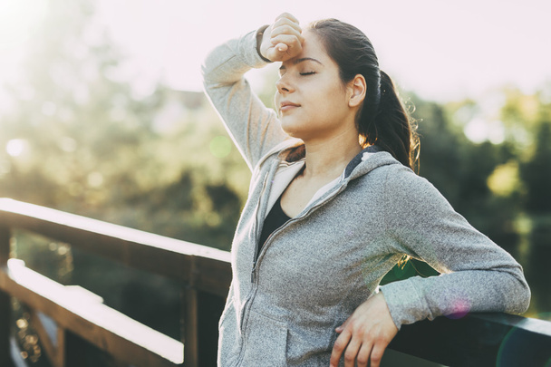 Beautiful female tired after jogging - Photo, image