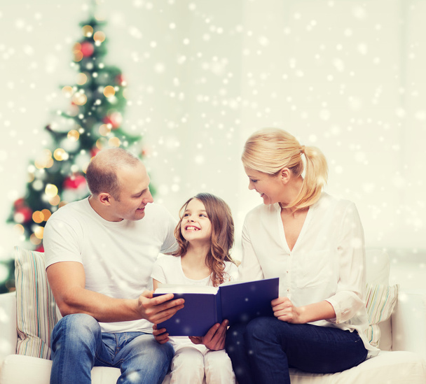 happy family with book at home - 写真・画像
