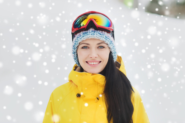 happy young woman in ski goggles outdoors - Foto, immagini