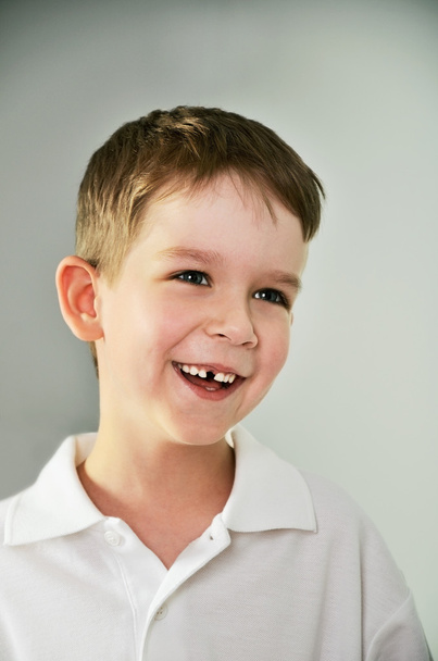 cheerful cute boy portrait. the boy opened his mouth and lost a - Foto, Imagem