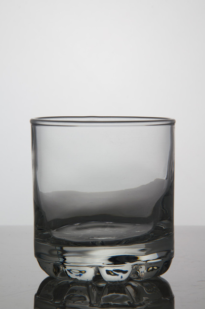 Empty glass of whisky on white background - Zdjęcie, obraz
