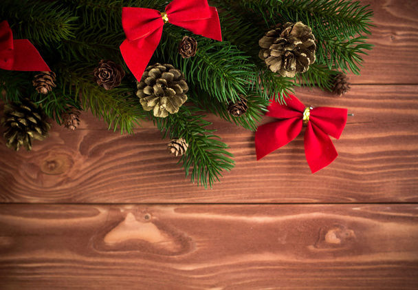 Christmas fir tree with decoration on dark wooden board. Soft fo - Zdjęcie, obraz