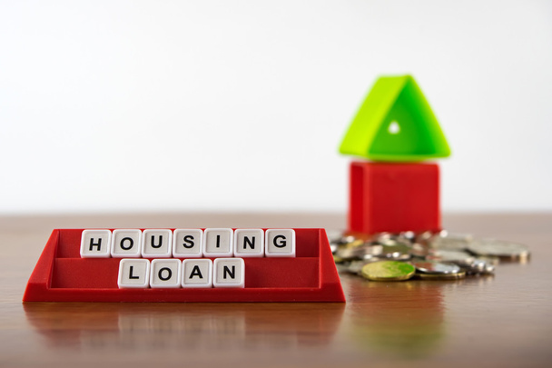 Conceptual photo of words "Housing Loan" spelled by alphabet blocks arrangement. - Photo, Image