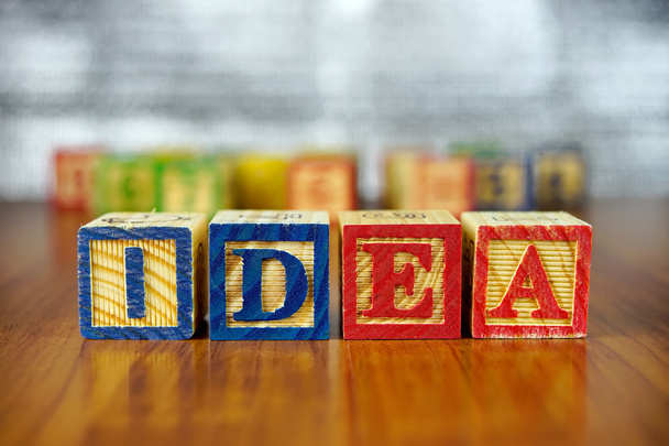 Word of IDEA spelled with colorful wooden alphabet blocks.Selective focus,shallow depth of field. - Fotoğraf, Görsel